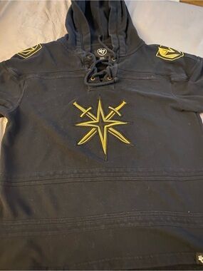 47 Black Lace-Up Hoodie with Yellow Star & Sword Emblem